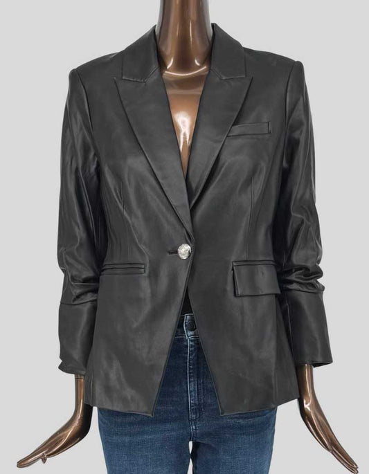 VERONICA BEARD black leather blazer featuring classic tailored silhouette. Buttery soft genuine leather with notched lapels, single crystal-embellished button closure, and front flap pockets. Long sleeves with ruched detailing, fully lined with signature striped lining.