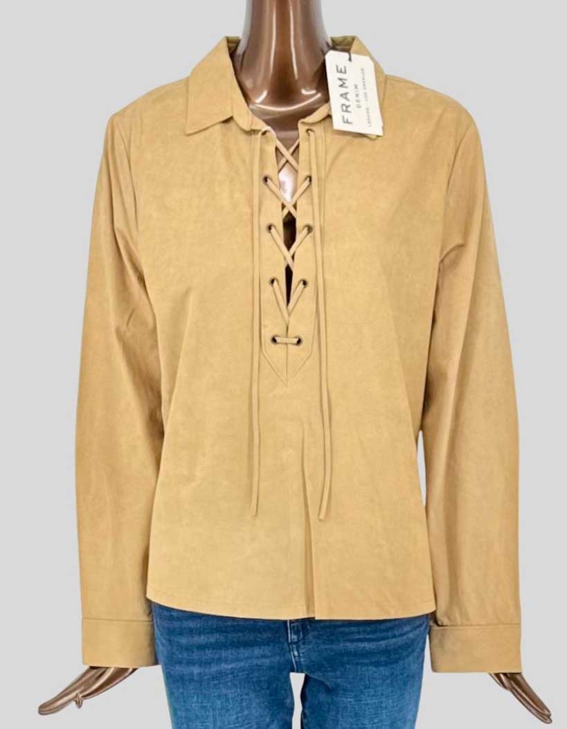 FRAME buttery soft suede pullover shirt in warm tan featuring a striking lace-up front with leather cord detailing. Classic spread collar and long sleeves with barrel cuffs. 