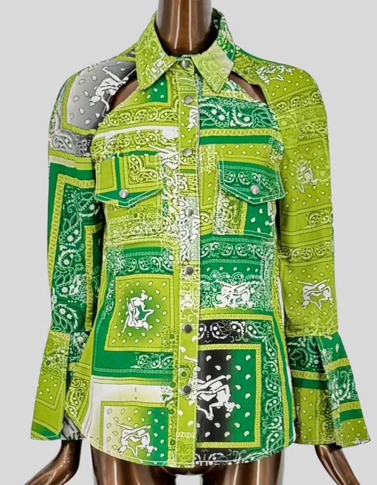 THEBE MAGUGU's Sisterhood Bandana blouse in green multi-tonal print features signature cutout detail at the collarbone, safari-style chest pockets, snap button closure, and flared bell cuffs. Point collar. 