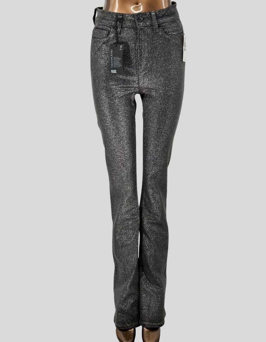 PAIGE's Manhattan High Rise bootcut jean in silver metallic Luxe Coating finish. Transcend fabric offers exceptional stretch and recovery with a leather-like look. Five-pocket styling, zip fly with button closure. 