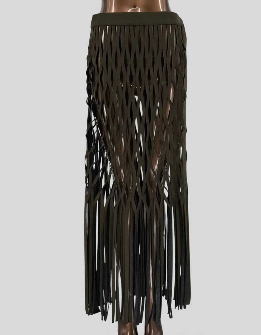 One-of-a-kind custom skirt created for AMC's PARISH TV series, worn by character Shamiso Tongai. Features an intricate diamond lattice cutout pattern throughout with long fringe hem. Solid waistband with side snap closure. Olive green felt construction.