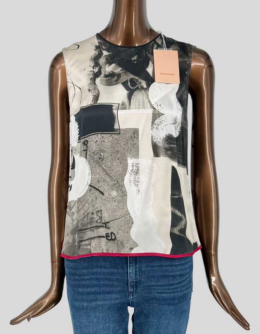 ROKSANDA sleeveless top features a striking abstract collage print in grey, black, cream, and white tones with a contrast fuchsia pink hem. High-Lo design. Round neckline, relaxed silhouette.