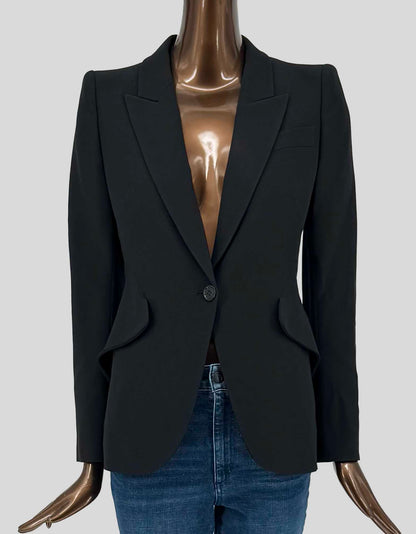 ALEXANDER McQUEEN's impeccably tailored single-button blazer in black features signature peak lapels, structured shoulders, and a nipped waist with curved hem. Welt chest pocket, flap hip pockets. Fully lined.