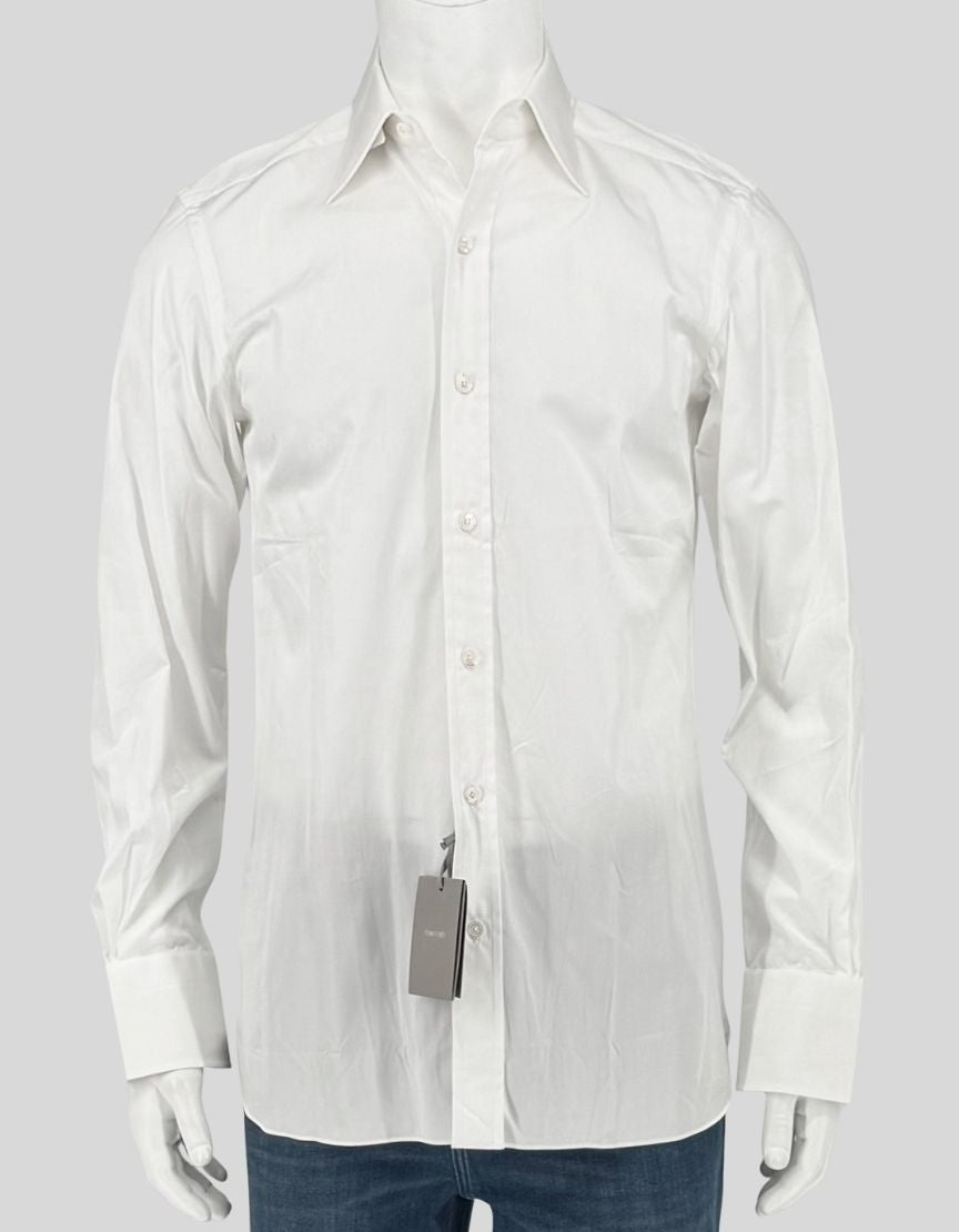 TOM FORD impeccably tailored white dress shirt with a refined point collar, button front, and barrel cuffs. Clean, timeless design in premium cotton with a subtle sheen. 