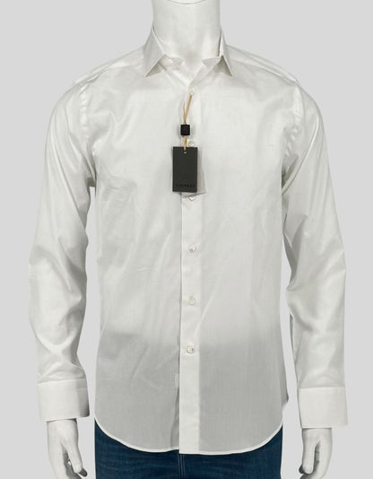  CANALI white dress shirt in crisp 100% cotton. Point collar, button front, barrel cuffs. Modern Fit offers a comfortable, classic silhouette. 