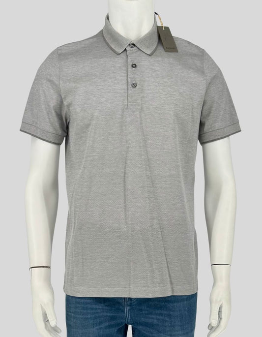 CANALI grey polo shirt in 100% cotton piqué. Three-button placket, short sleeves, ribbed collar and sleeve trim. 