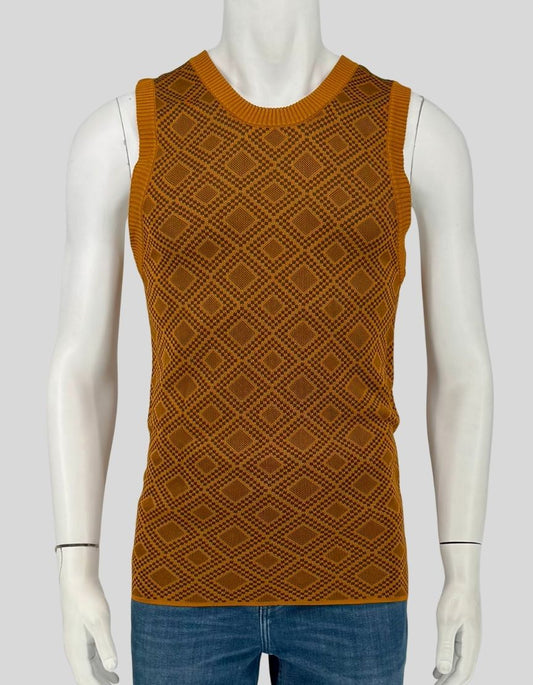 AHLUWALIA Kingpin knitted vest in ochre with geometric diamond jacquard pattern. Sleeveless silhouette, crewneck, ribbed trim at neck, armholes, and hem. 