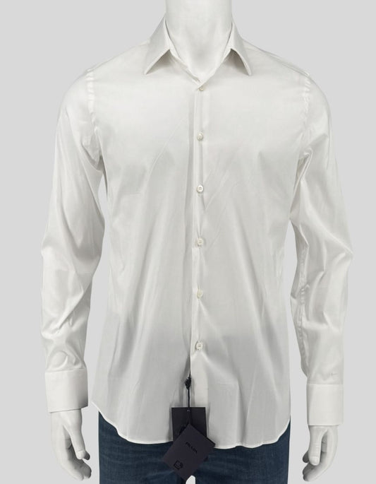 PRADA stretch poplin dress shirt in white (Bianco). Slim fit silhouette with classic spread collar, long sleeves, and mother-of-pearl button front closure. Tailored darts at back for a refined, body-skimming cut. Rounded hem. 