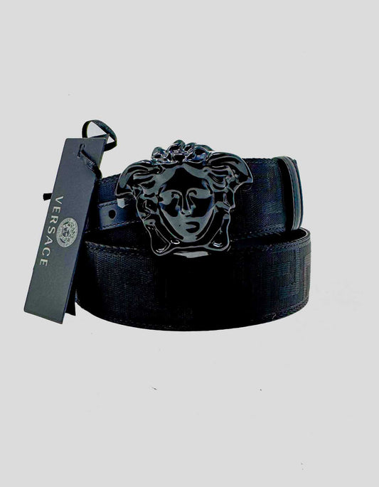 VERSACE La Medusa belt featuring the signature Versace Allover logo jacquard canvas strap with matte black-tone hardware for a sleek, tonal effect. Features the iconic sculptural Medusa head buckle in matching black finish — a modern, understated take on the house's signature motif. 