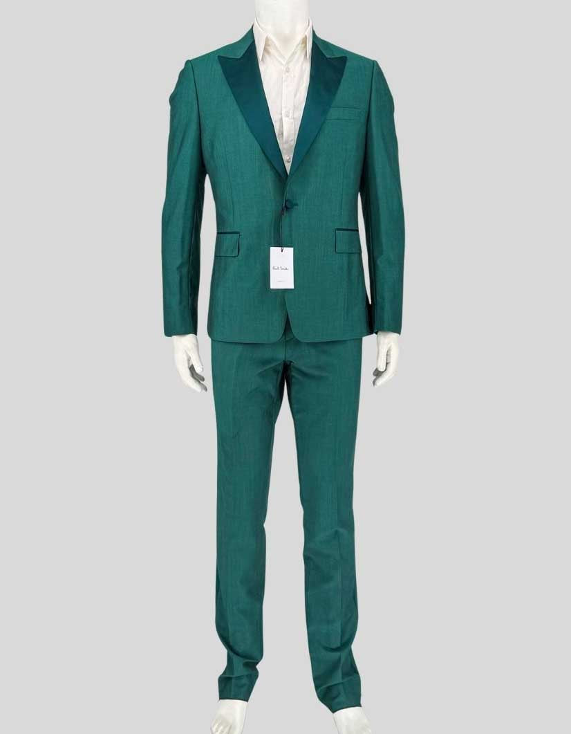 PAUL SMITH evening suit in dark green — a bold alternative to traditional black tie from the British designer known for putting a twist on classic menswear. Crafted from 84% wool and 16% mohair for natural sheen and crease resistance. The tailored-fit single-breasted jacket features a one-button closure, tonal satin peak lapels, covered buttons, and satin-piped flap pockets.