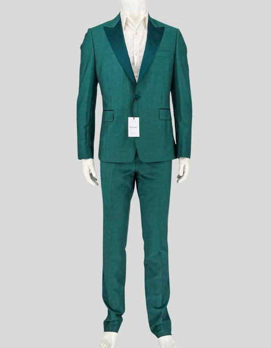 PAUL SMITH evening suit in dark green — a bold alternative to traditional black tie from the British designer known for putting a twist on classic menswear. Crafted from 84% wool and 16% mohair for natural sheen and crease resistance. The tailored-fit single-breasted jacket features a one-button closure, tonal satin peak lapels, covered buttons, and satin-piped flap pockets.