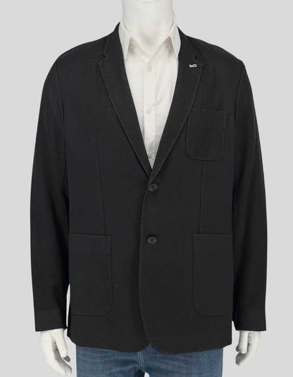 RAG & BONE wool blazer in black. Single-breasted jacket features notched lapels, two-button closure, patch pockets, and cotton lining. Unstructured construction for a relaxed, modern fit.