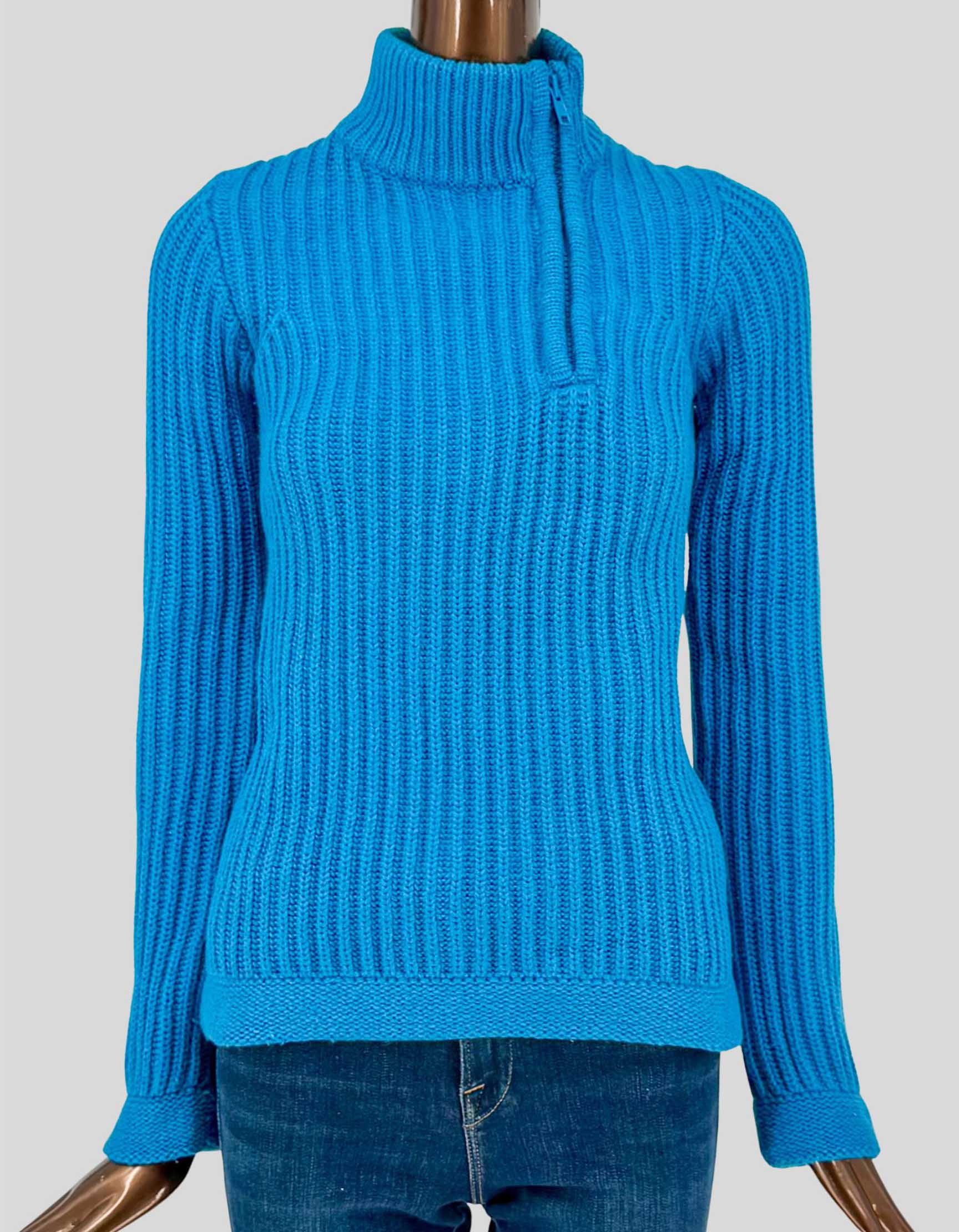 MARC JACOBS ribbed mock neck sweater in vibrant bright blue. Made from a luxurious blend of 50% angora rabbit hair, 30% wool, and 20% polyamide, this sweater offers exceptional softness and warmth. The allover ribbed knit construction creates rich texture, while the mock neck features a functioning zipper for adjustable styling.