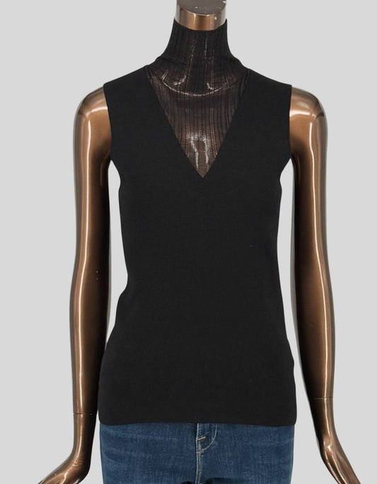 THEORY layered sleeveless top in black. Sleeveless V-neck outer shell in fine knit wool blend over sheer ribbed turtleneck underpinning. Modern layered design creates sophisticated silhouette. Slip-on styling. 