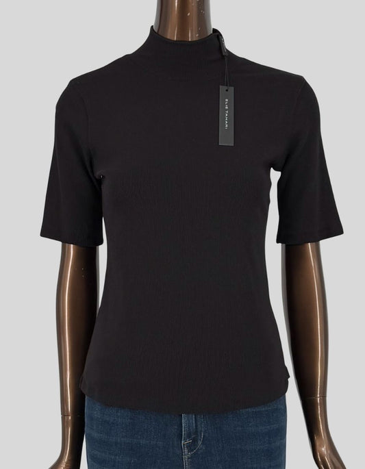 ELIE TAHARI ribbed knit mock neck top in black. Short sleeves with fine ribbed texture throughout. Mock turtleneck. Fitted silhouette. Slip-on styling. Made from soft, stretchy rib knit fabric.