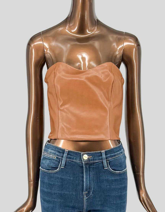 TEN by BABATON (Aritzia) CINDY vegan leather bustier in rich cognac tan. Strapless design with sweetheart neckline and princess seams for flattering, structured fit. Made with Aritzia's premium Stretch Vegan Leather
