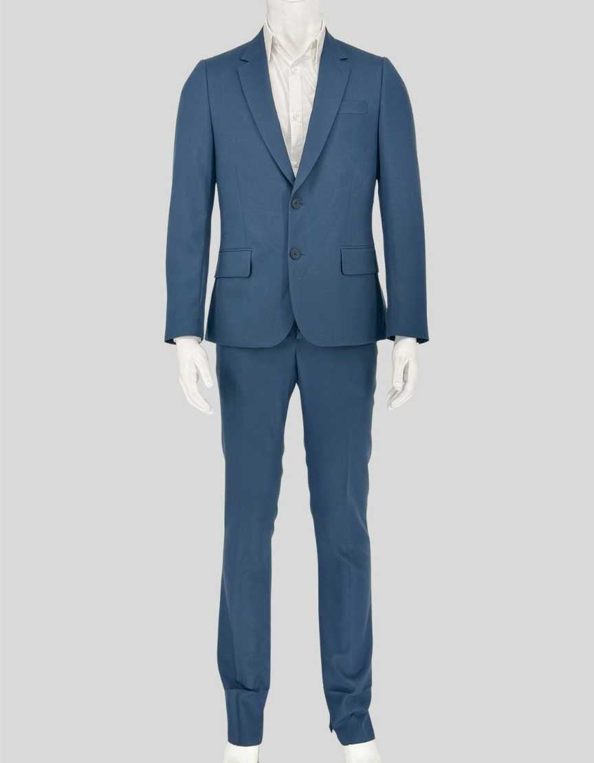 PAUL SMITH two-piece suit in distinctive light blue wool featuring the modern SOHO fit. Italian-made blazer with two-button closure, notched lapels, and flap pockets. 
