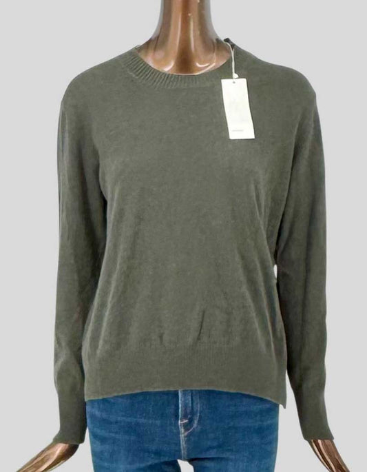 VINCE crew neck sweater in 100% cashmere with olive green finish. Ribbed crew neckline, long sleeves with ribbed cuffs, and ribbed hem. Relaxed fit construction. Tie closure design on left side. Arrives new with all original tags attached.